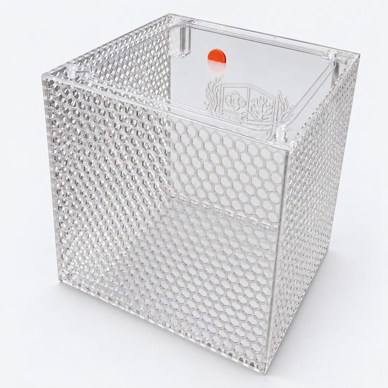 Clear acrylic acclimation box with honeycomb ventilation, a clear lid, and an orange pull tab.